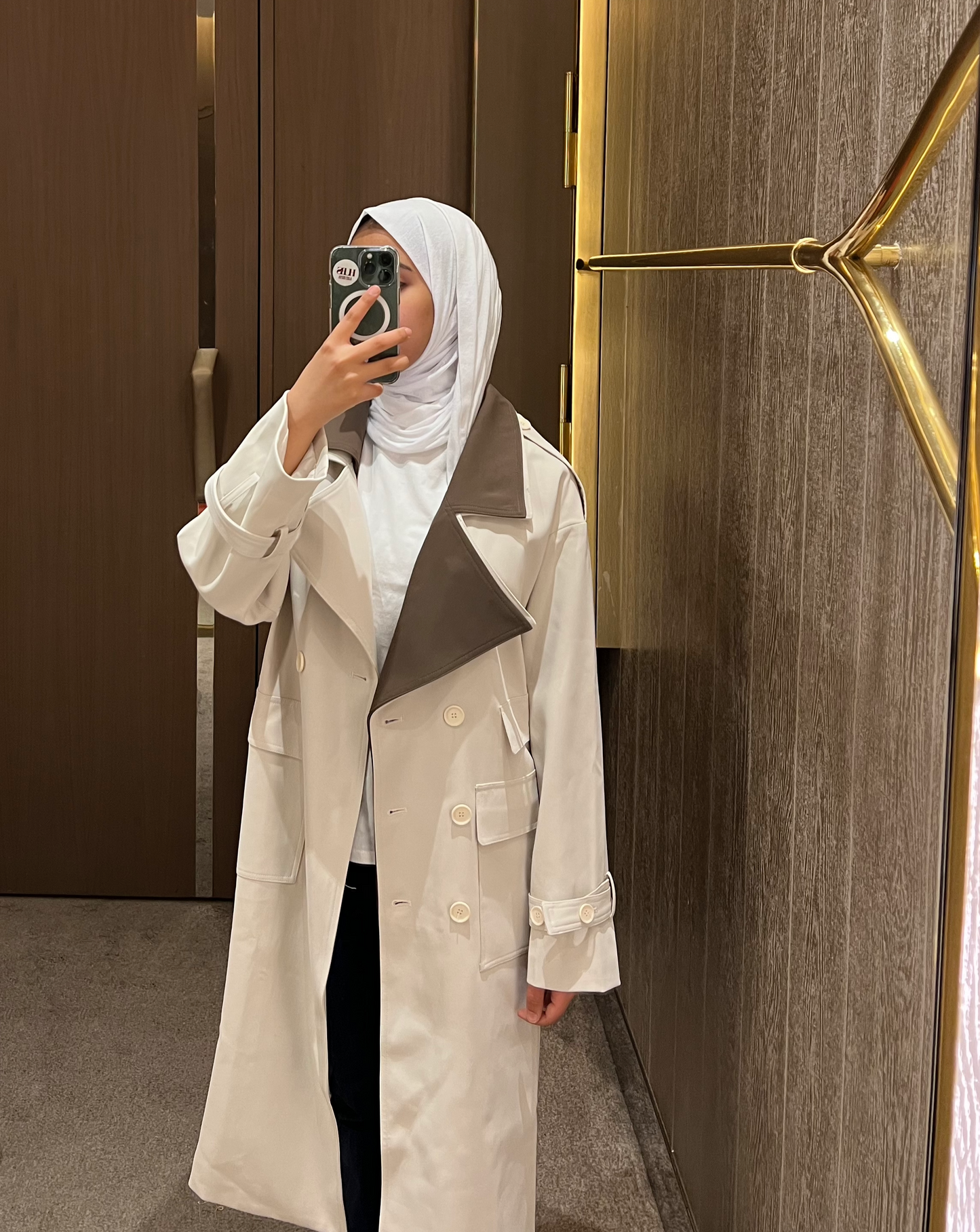 Beige double breasted trench coat