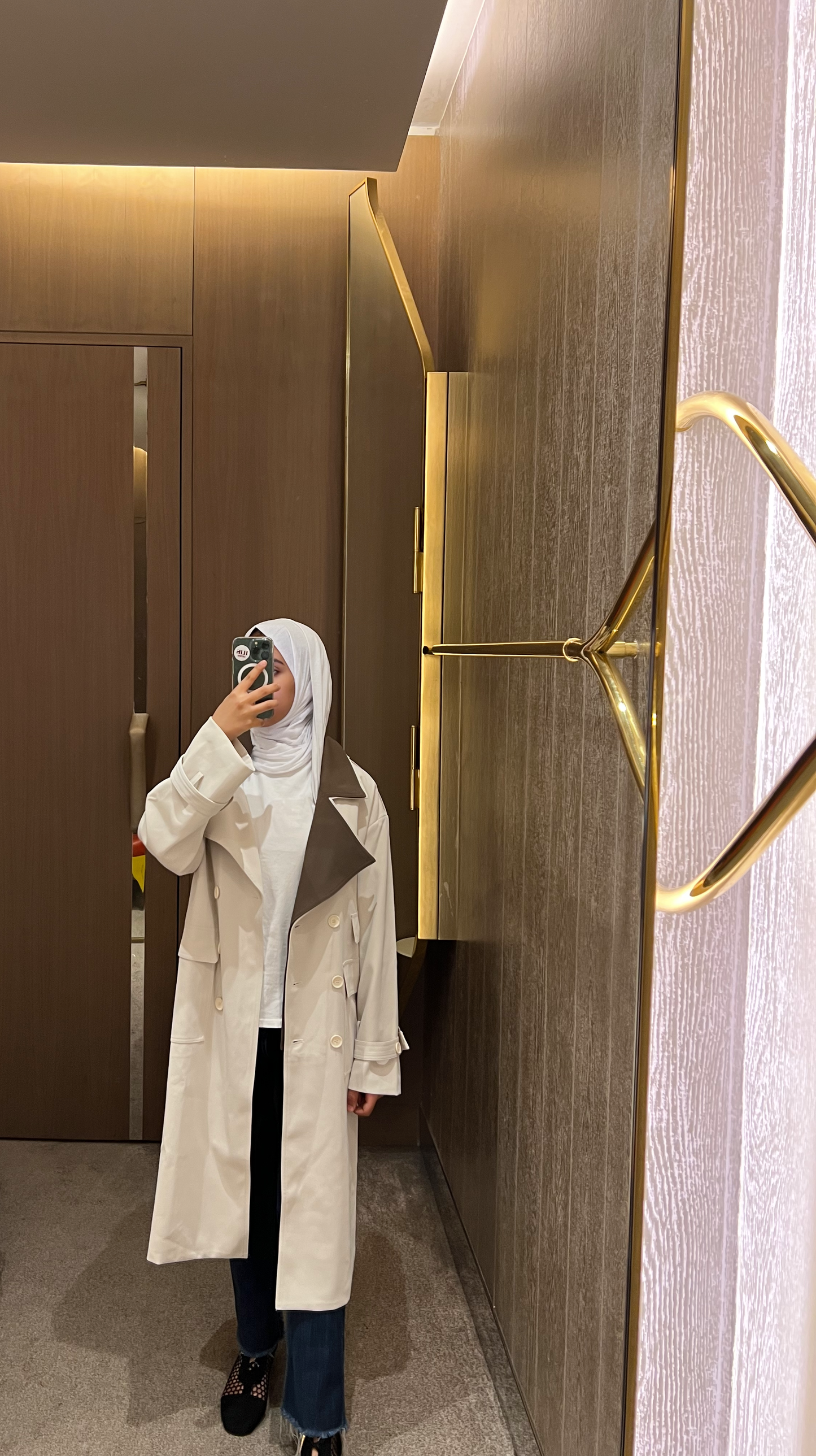 Beige double breasted trench coat